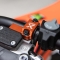 X-GRIP OSŁONA OBEJMA WZMOCNIENIE POMPY SPRZĘGŁA (ANTI BREAK CLAMP CLUTCH) BREMBO PO 2024 ROKU BETA,KTM, HUSQVARNA,SHERCO,GASGAS KOLOR POMARAŃCZOWY